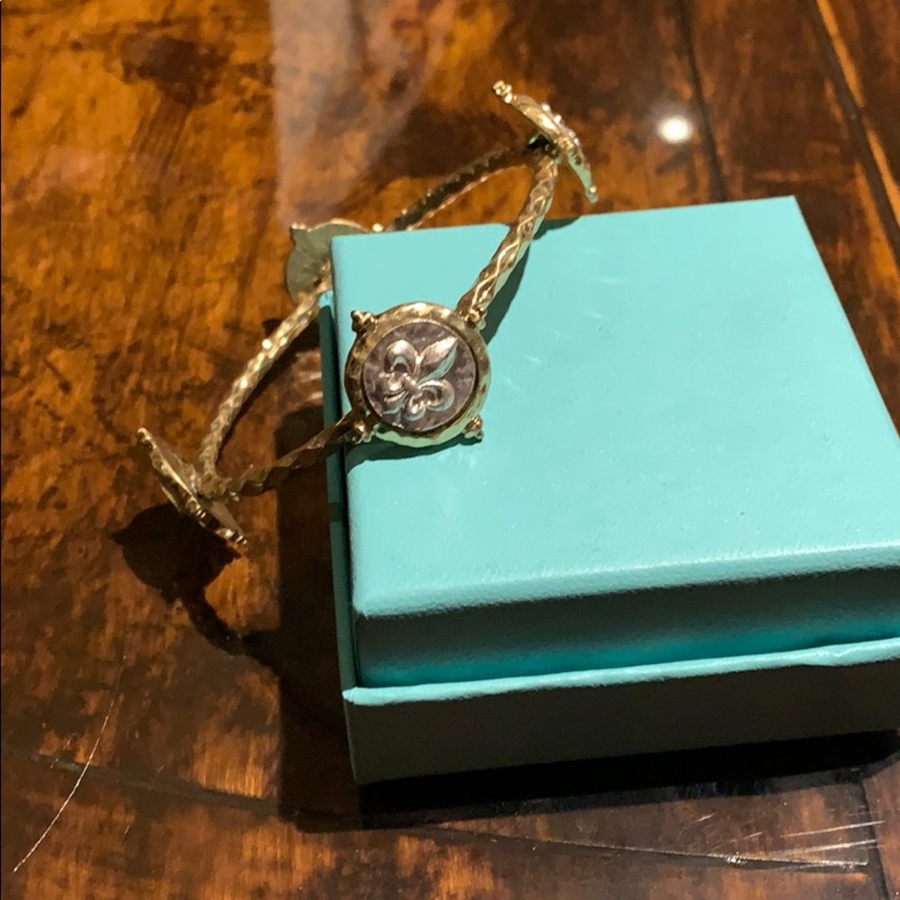 Gold tone bangle fleur de lis